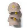 Gorra Ñ beige con letra dorada (estilo Dad hat)